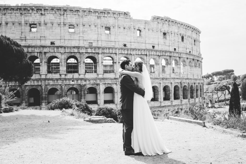 Bride and groom embrace in Rome, Italy by elopement photographer Peggy Picot