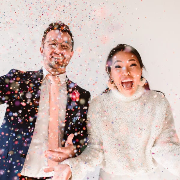 Couple throwing confetti
