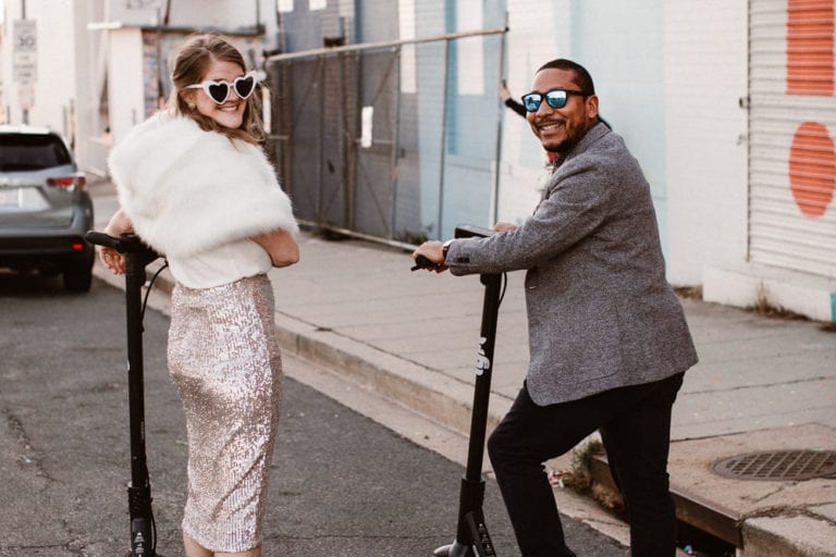 Couple riding a lyft scooter