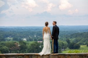 View of an elopement ceremony option from the stone wall at The Stable at Bluemont Vineyard with the view of the Loudoun Valley as the backdrop.